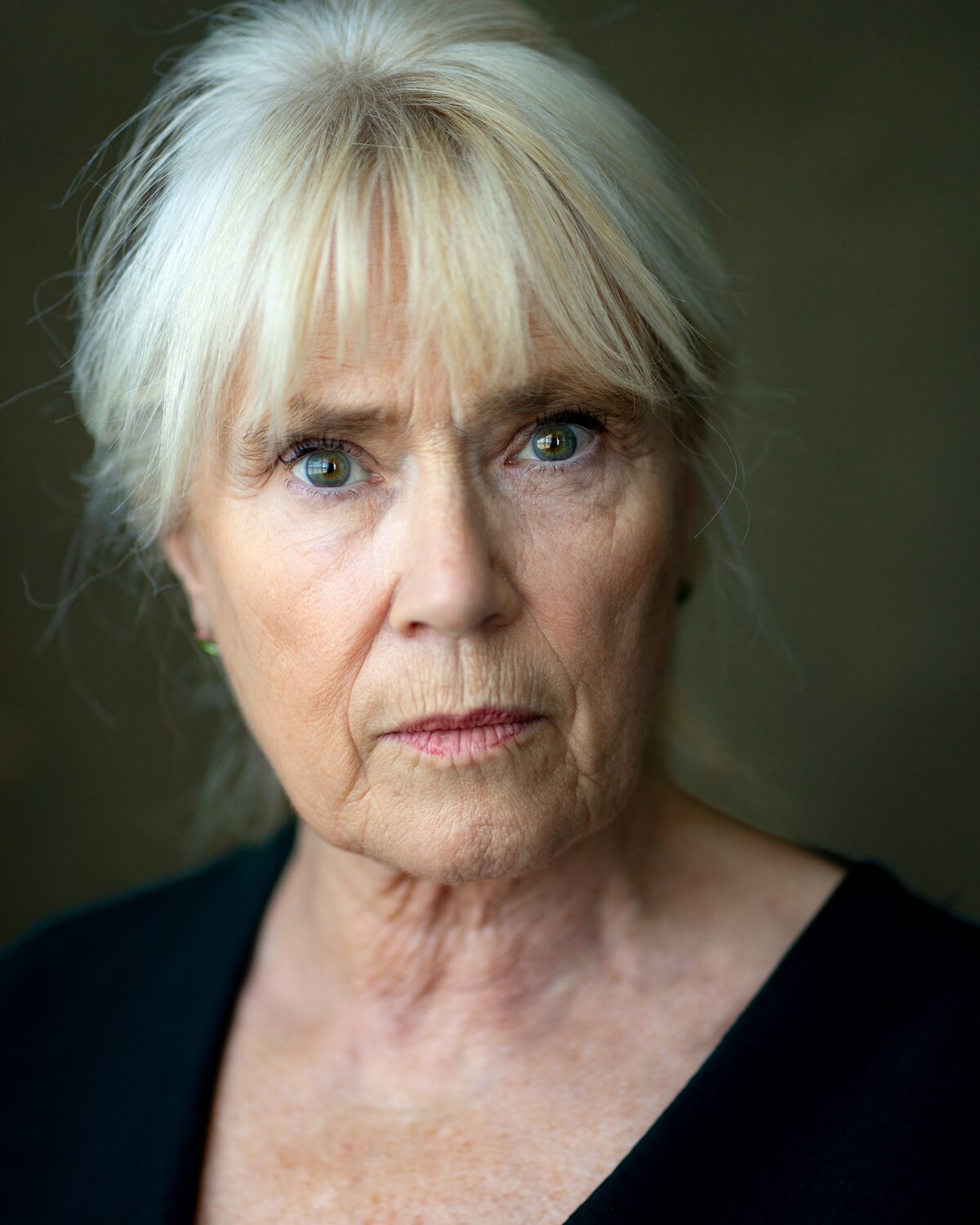Headshot of Maggie Saunders with her hair up